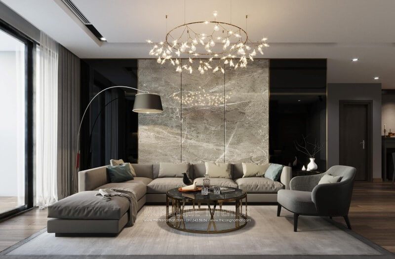 Không gian phòng khách căn hộ chung cư đầy ấn tượng từ bộ sofa văng phong cách hiện đại bọc da màu ghi sang trọng và tiện nghi.