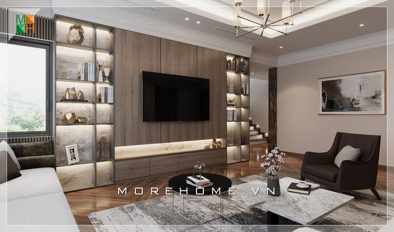 Mẫu kệ tivi phòng khách cao cấp, với thiết kế vách treo tivi ốp gỗ kết hợp kệ trang trí, vừa tiện lợi để trưng bày những món đồ yêu thích của gia đình vừa đóng vai trò như một bức vách ngăn cách cầu thang